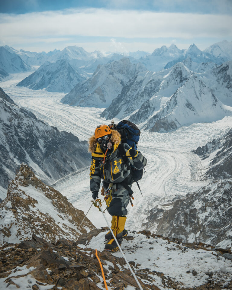 PK Sherpa wearing an oxygen mask and Under Armour suit on winter K2