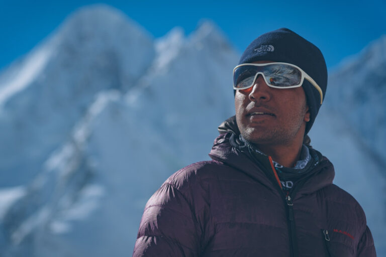 Sajid Sadpara, medium shot with white glasses near K2 basecamp